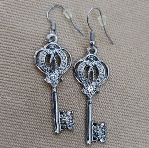 Silver tone stylized key hook earrings
